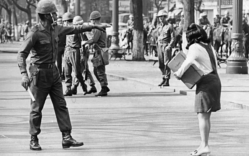 A university student confronts a military policeman during a protest against the dictatorship