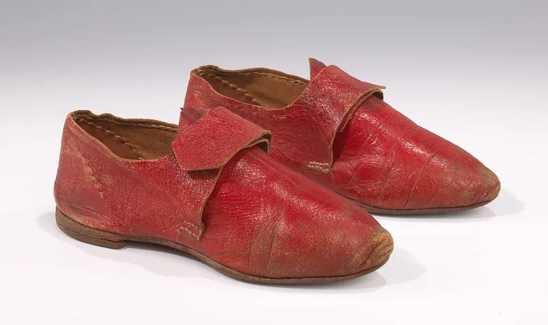 A fashion plate from the 1840s illustrating the style of red leather shoes from the period