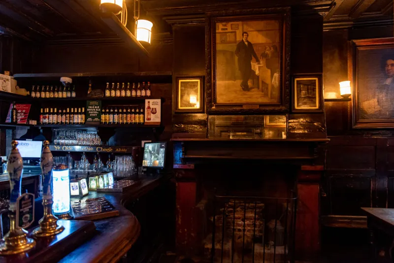 Interior of Ye Olde Cheshire Cheese, showing the bar and fireplace that evoke its seventeenth-century setting. (Image credit: Ye Olde Cheshire Cheese)
