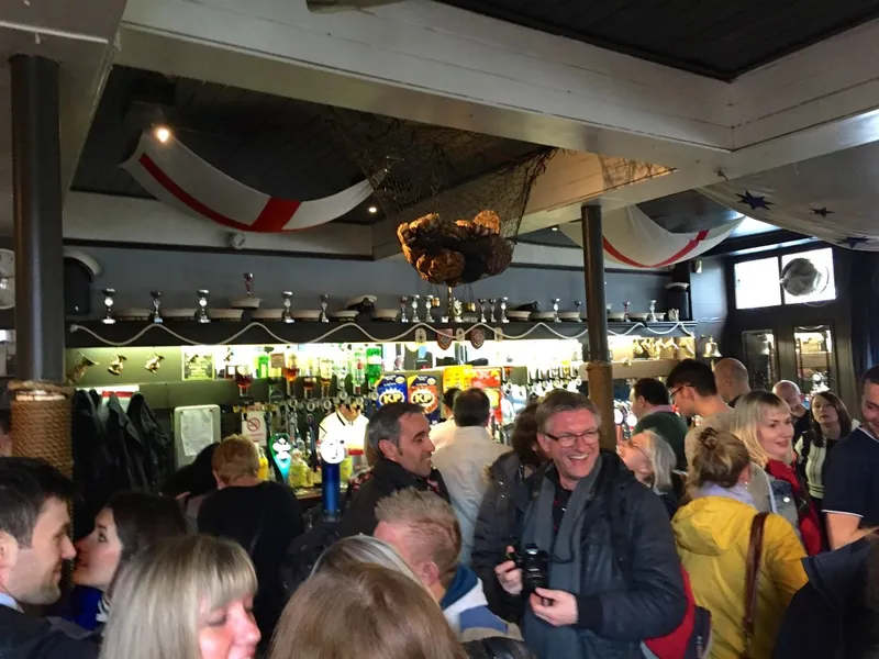 Interior of the pub today with the buns hanging on the ceiling.