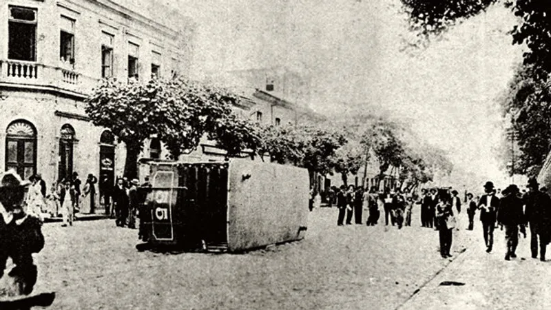 A tram overturned during the Vaccine Revolt in Rio de Janeiro, 1904, sparked by public opposition to mandatory smallpox vaccination. (Image source: Wikimedia Commons)