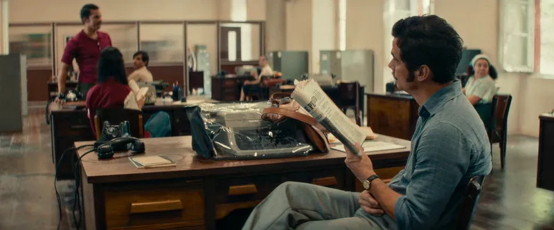 Armando works at a government documentation center where he hides under a false identity